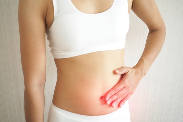 woman stomachache on white background